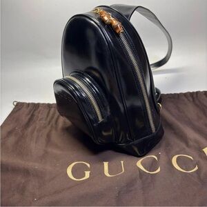 Gucci Black Leather Sling Bag with Gold Accents